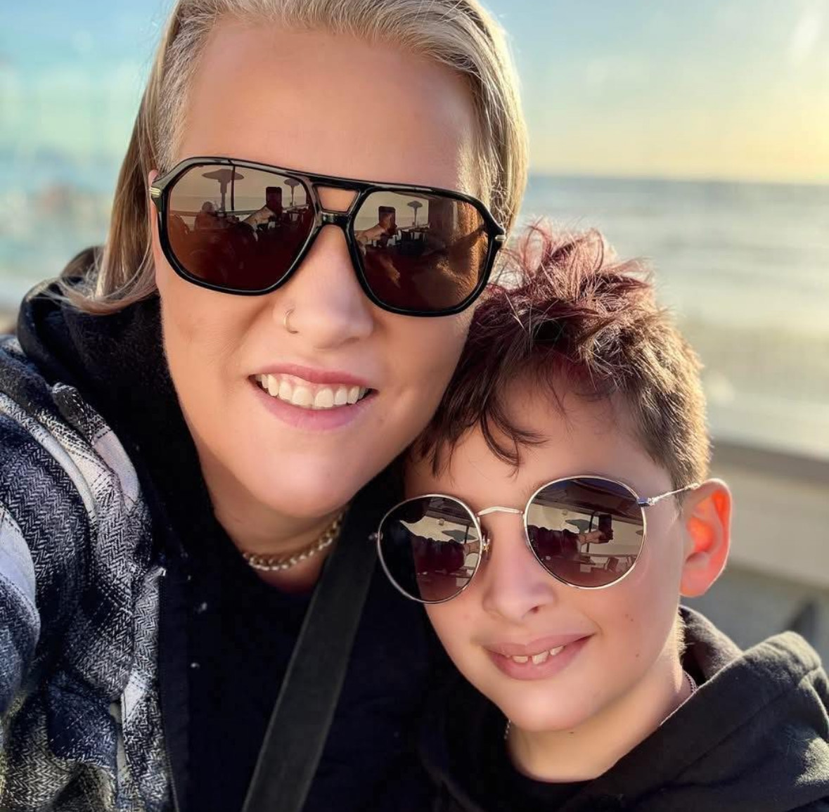 Stacey with her son at the beach